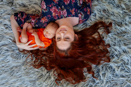 mom and newborn boy photographed from above