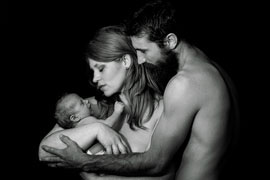 black and white image, new parents with newborn
